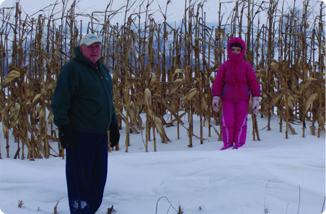 girl standing behind man