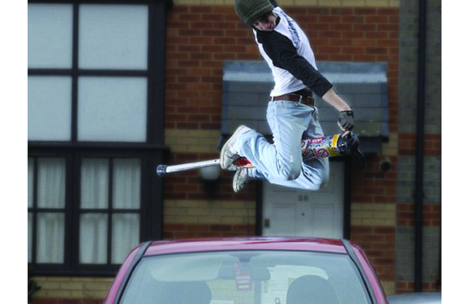 man jumping over car