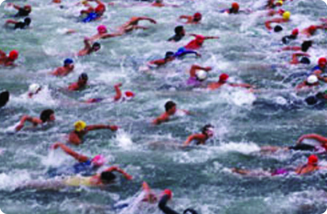 men swimming in ocean