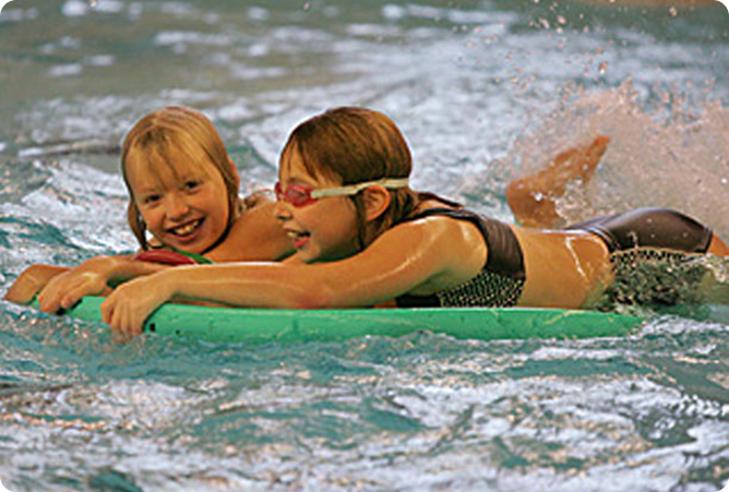 two girls swimming